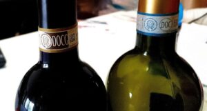 A photo of two wine bottles bearing the marks DOCG and DOC which are recognized labels under the Italian wine classification system, similar to Cru in France.